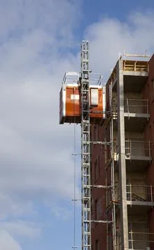 Construction site temporary personnel elevator at building wall, Finland Fotos de archivo