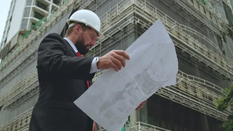 Construction site there is a civil engineer,designer, according to the drawings Stock Footage 171089591
