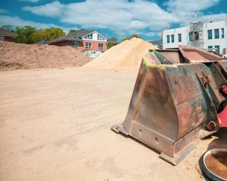 On  construction site there is a wheel loader with a shovel Stock Photos