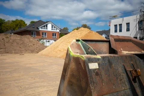 On  construction site there is a wheel loader with a shovel Stock Photos
