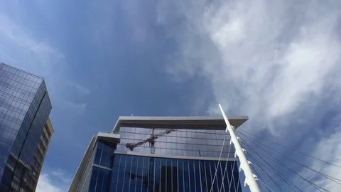 Construction Site Tilt down from Glass Building Stock Footage 81457701