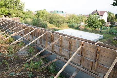 Construction site. The timber formwork is prepared for pouring concrete. The Stock Photos