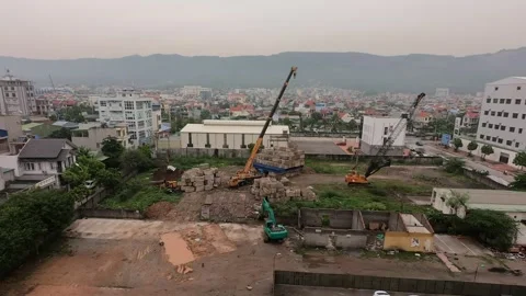 Construction site time lapse. A crane is moving concrete blocks Stock Footage 167249421