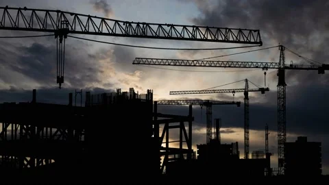 Construction site: Time Lapse at Sunrise with Fast Clouds Stock Footage 154163796