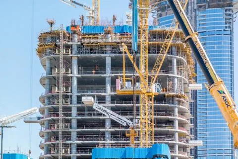 Construction site, tools, crane and building under construction Stock Photos