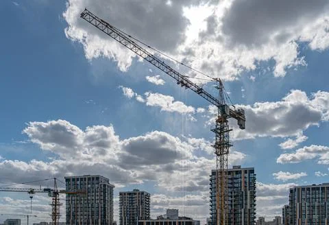 Construction Site with Tower Crane and Modern Skyscrapers 库存照片