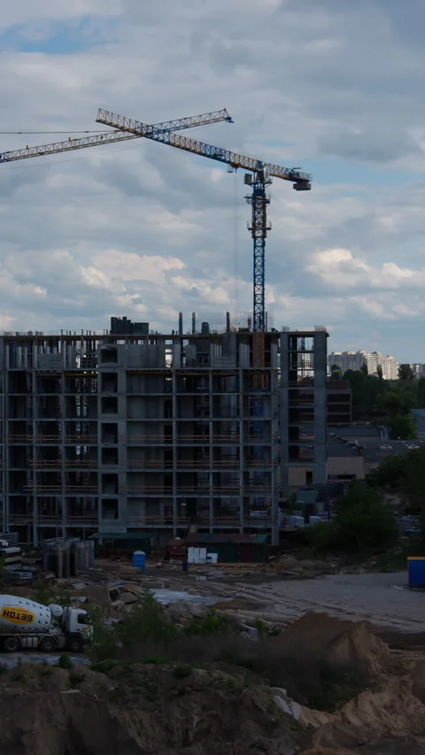 Construction site tower crane building apartment complex timelapse footage Видео 310997846