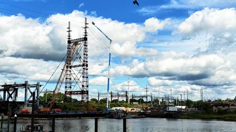 Construction site with tower crane building power lines 스톡 동영상 344048766