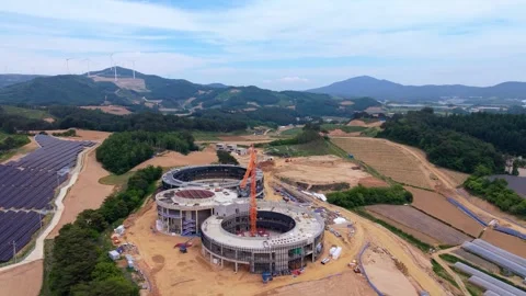 Construction site with tower crane solar farm wind turbines Daegwallyeong Korea 스톡 동영상 340411532