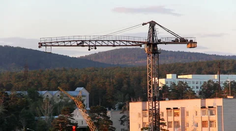 Construction site with tower crane at sunset 库存影片 921434