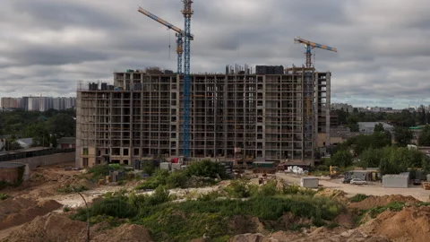 Construction site with tower cranes and residential buildings in urban city.. Video stock 313740038
