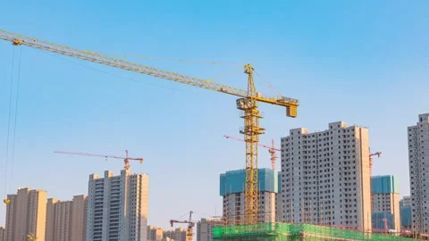 Construction site with tower cranes and unfinished high rise residential Stock-Footage 342265173