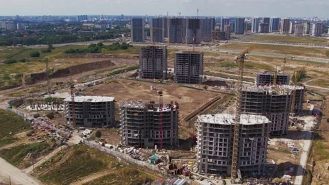 Construction site tower cranes, monolithic frame houses, aerial panorama Stock Footage 158617336