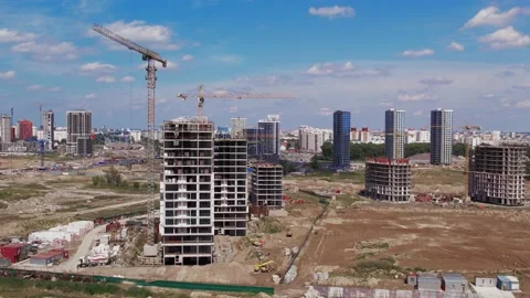 Construction site tower cranes, monolithic frame houses, aerial panorama Stock Footage 158618224