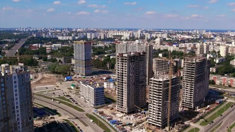 Construction site tower cranes, monolithic frame houses, aerial panorama Stock Footage 158619736