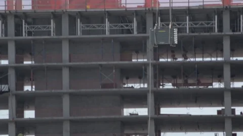 Construction Site Tracking materials lifted by Crane Stock Footage 81453818