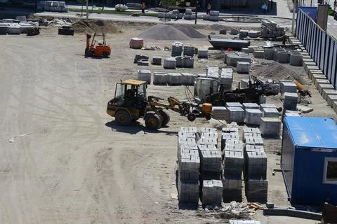 A construction site with a tractor and a loader Stock Photos