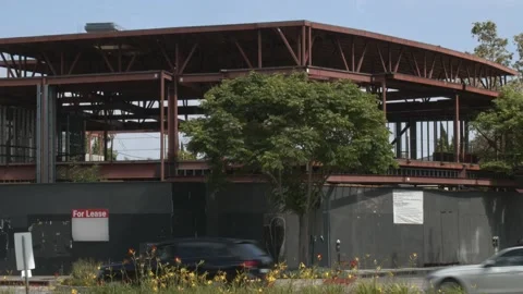 Construction Site With Traffic In Foreground - For Lease Stock Footage 131603490