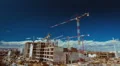 Construction site trucks,machinery,workers,cranes, wide view timelapse HD Footage