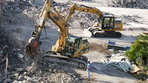 Construction site with two demolition grapples at work Stock Footage 197002444