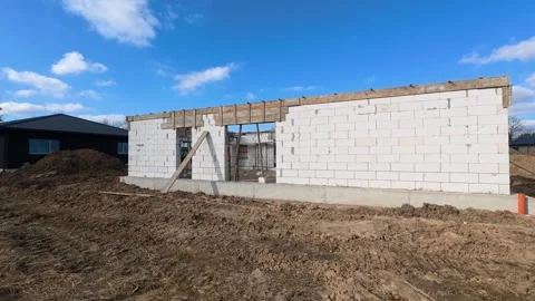 Construction Site with Unfinished Building under Blue Sky 스톡 동영상 332618026