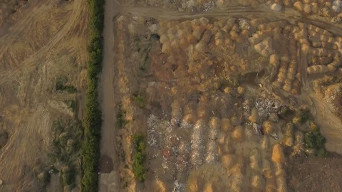 Construction site. A vacant lot with heaps of sand on the outskirts of the city  Video stock 108399633