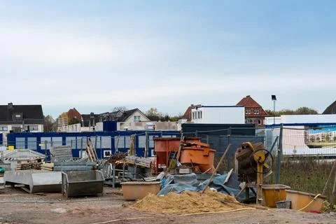 Construction site with various materials and equipment in urban area Stock Photos