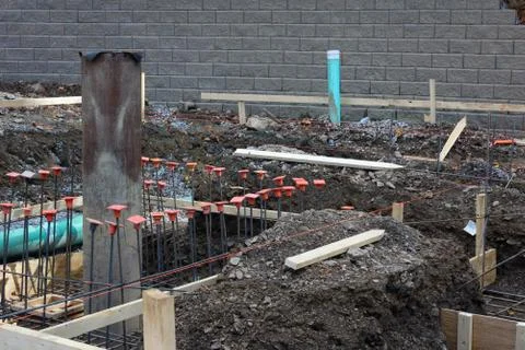Construction site view with level lines pipes and rebar Stock Photos