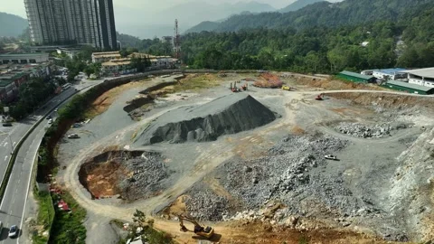 Construction Site View with Mountains in Background, Excavation Area Surrounded Stock Footage 316450769