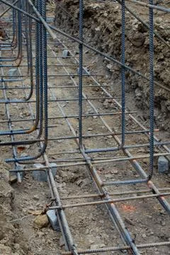 Construction site view of supported grid of steel rebar reinforcement Stock Photos