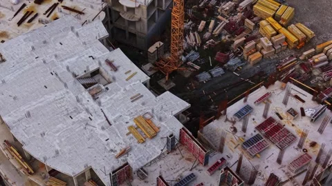 Construction site viewed from above with materials and equipment scattered Stock Footage 324522991