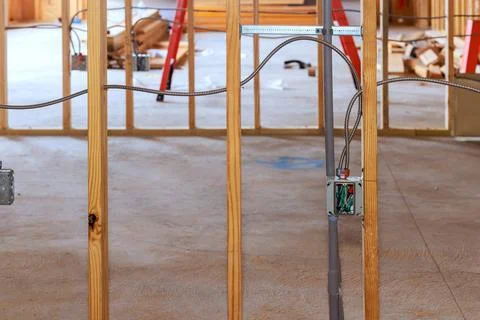 Construction site walls with electrical wiring tools in new building Stock Photos