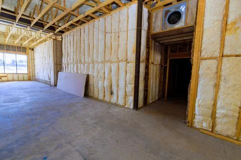 Construction site walls with insulation empty space in building during reno.. Stock Photos