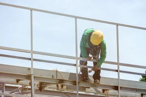 In the construction site, the welding workers at work., worker weld metal in Stock Photos