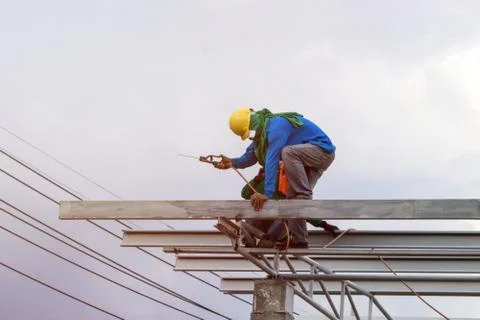 In the construction site, the welding workers at work., worker weld metal in Stock Photos