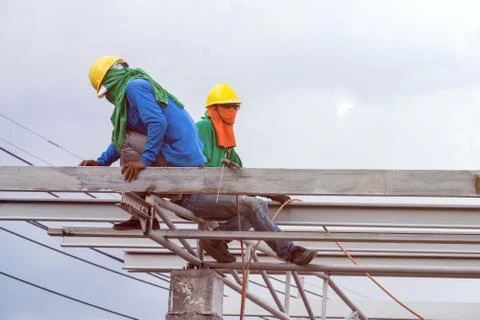 In the construction site, the welding workers at work., worker weld metal in Stock Photos