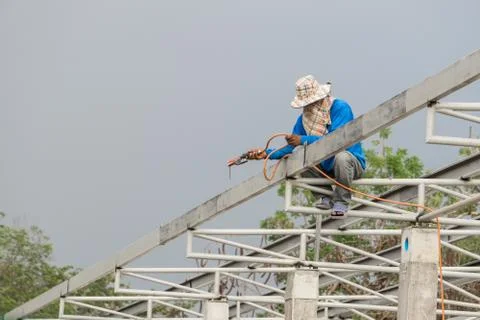 In the construction site, the welding workers at work., worker weld metal in Stock Photos
