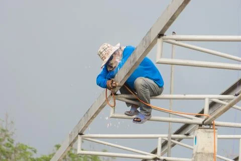 In the construction site, the welding workers at work., worker weld metal in Stock Photos