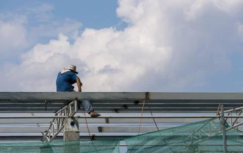 In the construction site, the welding workers at work., worker weld metal in Stock Photos