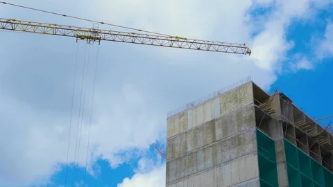 Construction site on which to build high-rise buildings with cloudy blue sky. Stock Footage 110603916