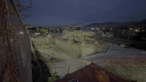 Construction site wide shot at night in Vancouver, B.C., skytrain, 4k Stock Footage 232448229