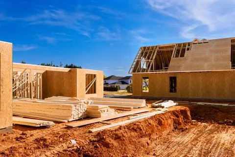 Construction site with wooden beams frames for two houses Fotos Stock
