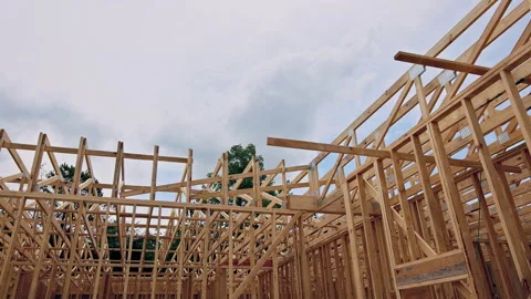 Construction site with wooden framework roofing beams trusses Stock Footage 338115881