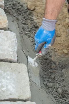 Construction site work with concrete mixer and wheelbarrows Foto stock