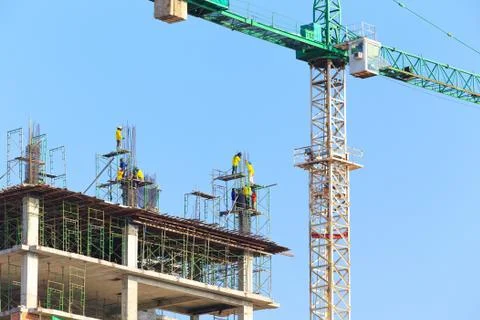 Construction site with worker on blue sky Stock Photos