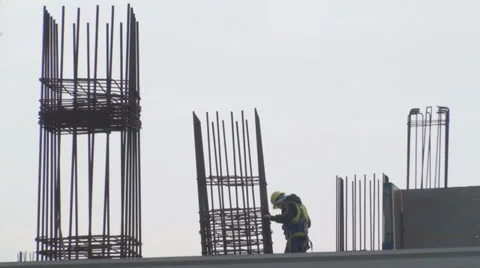 Construction Site With A Worker Climbing Down From A Pole Stock-Footage 35231332