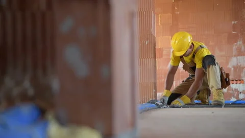 Construction Site Worker Finishing Floor Base Installations Stock Footage 141034766