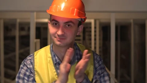 On a construction site, a worker or engineer or architect is looking at camera Stock Footage 89085405