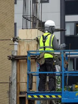Construction Site Worker On Platform Stock Photos