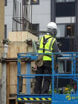 Construction Site Worker On Platform Stock Photos